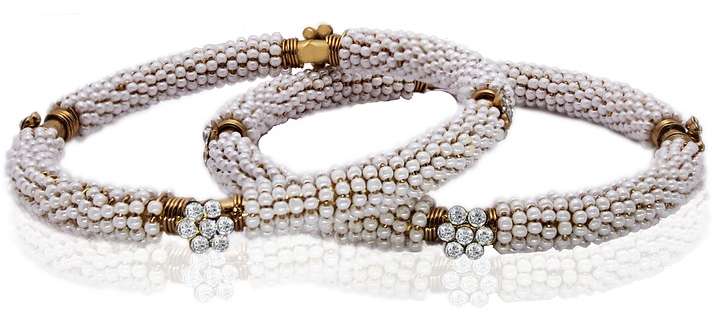 two diamond encrusted bracelets